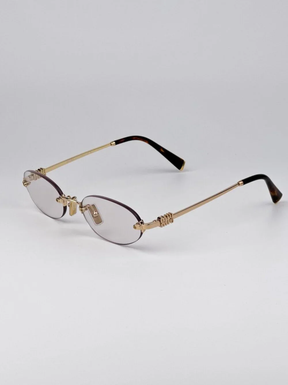 Miu Miu Women’s Eyeglasses – MUA54S 5AK08N | Gold Oval Rimless